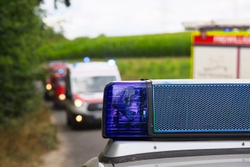 Fire, Police, and Ambulances on the scene of an emergency situation.